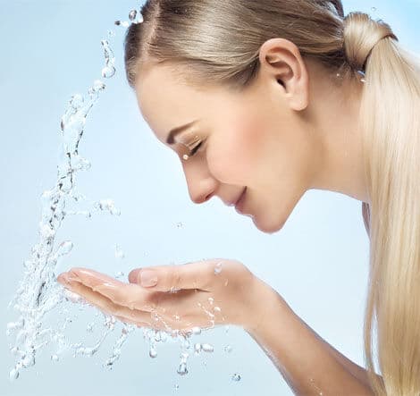 Get your spring skin glowing! 2 Girl splashing water on her face 2