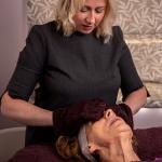 The Skinologist - Fiona performing a facial treatment with mitts on a client at the Chester Skin clinic
