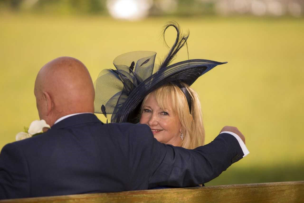 Picture of Iris on her wedding day with her husband. Looking happy with radient skin and no signs of rosacea.